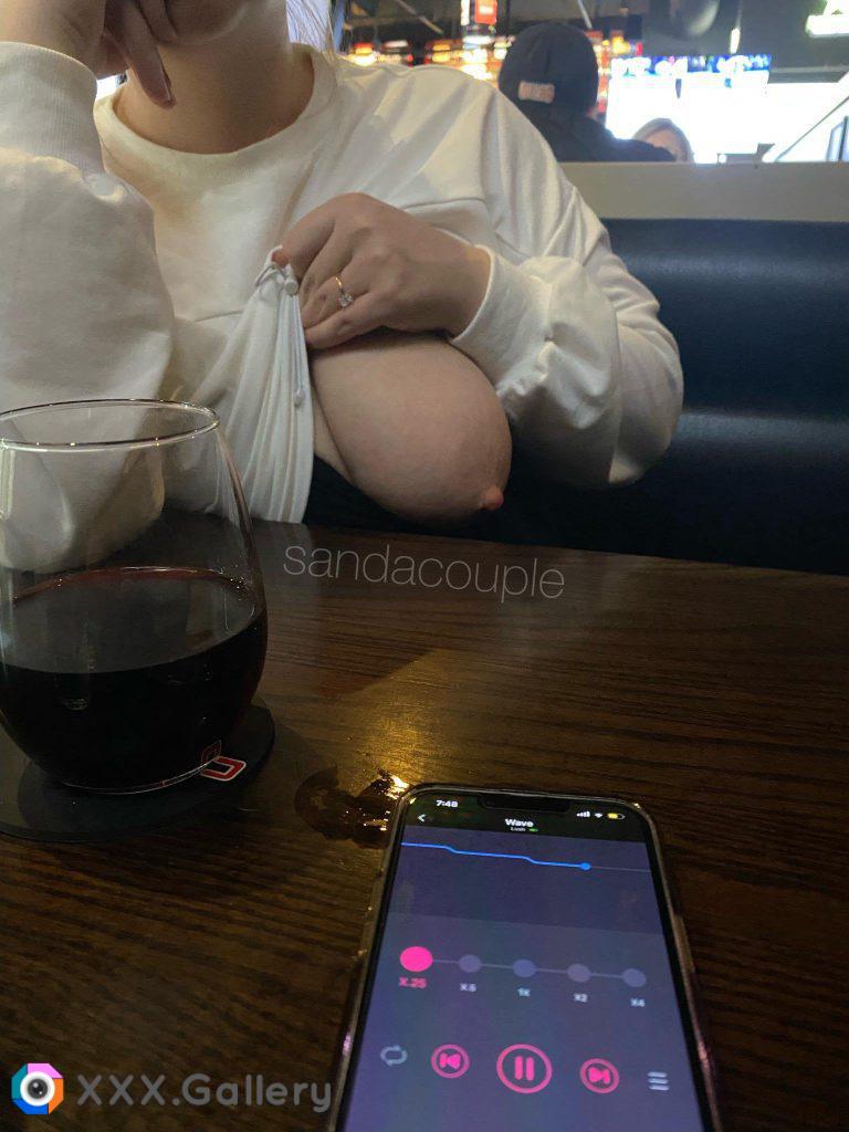 Showing off my tits at a local bar while a stranger controls my vibrator [IMG]