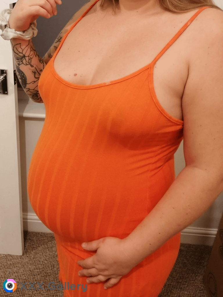 18 weeks pregnant and so big already 😍 I have nothing on under my dress and I'm so horny would you lift up the dress and fuck me?