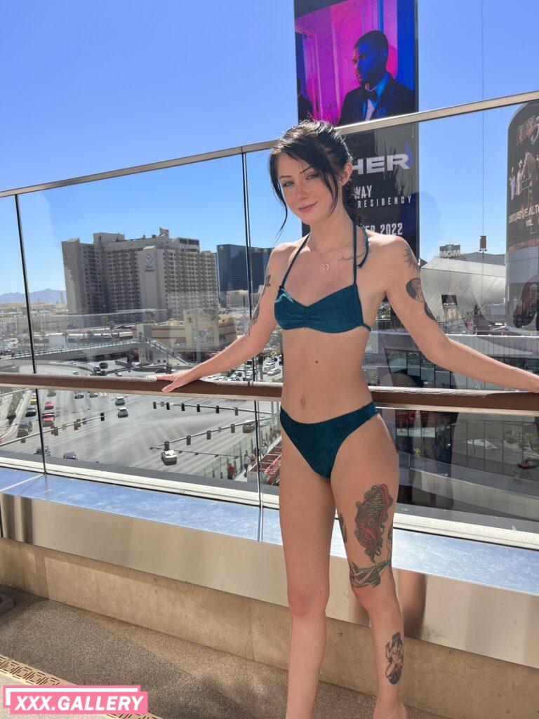 Tattooed little slut on the rooftop pool deck